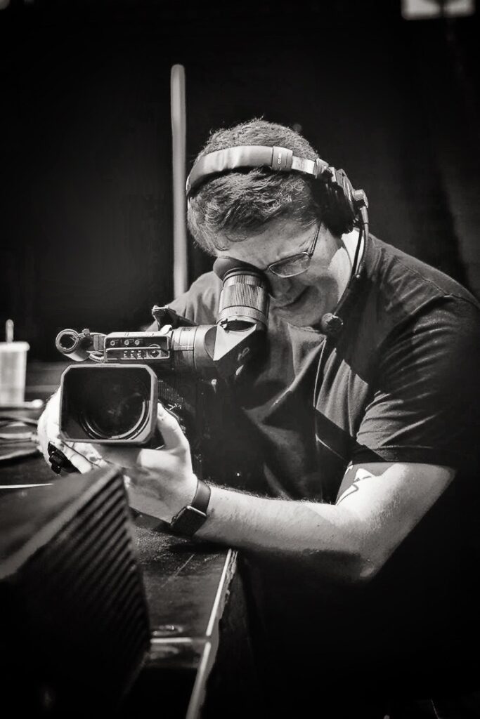 Michael Evan Moore as a camera operator for CBU's event center back in 2018